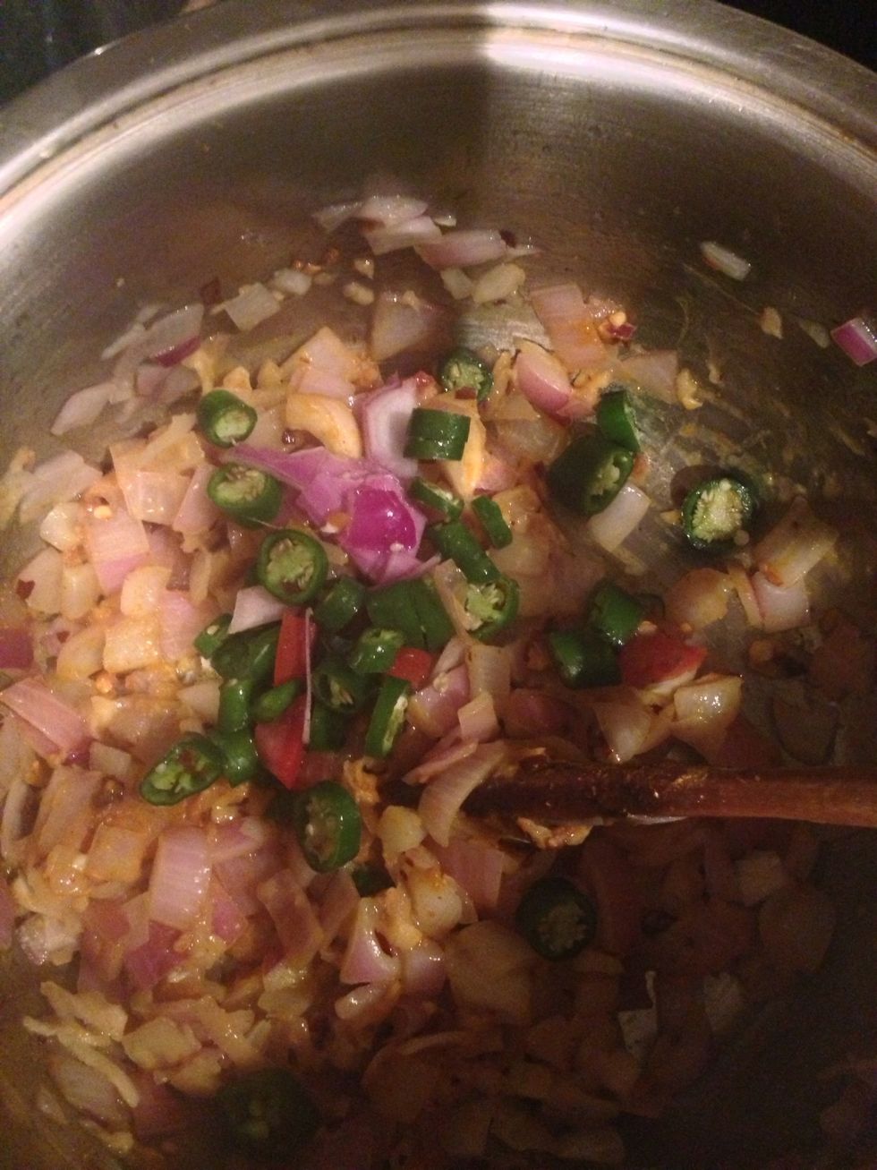 Add the chopped green hot chilli.