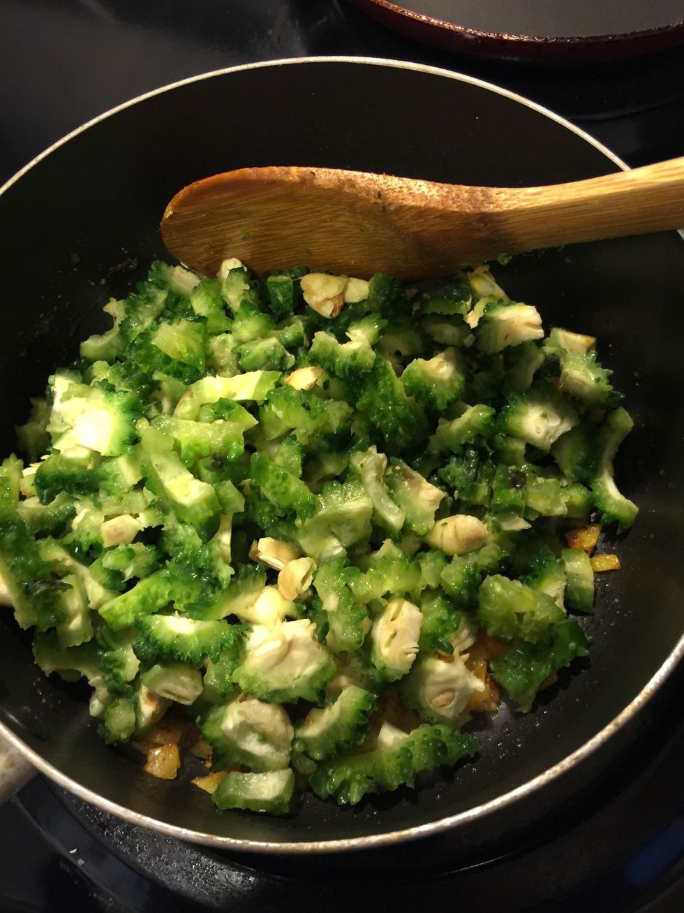 Add the chopped karela.