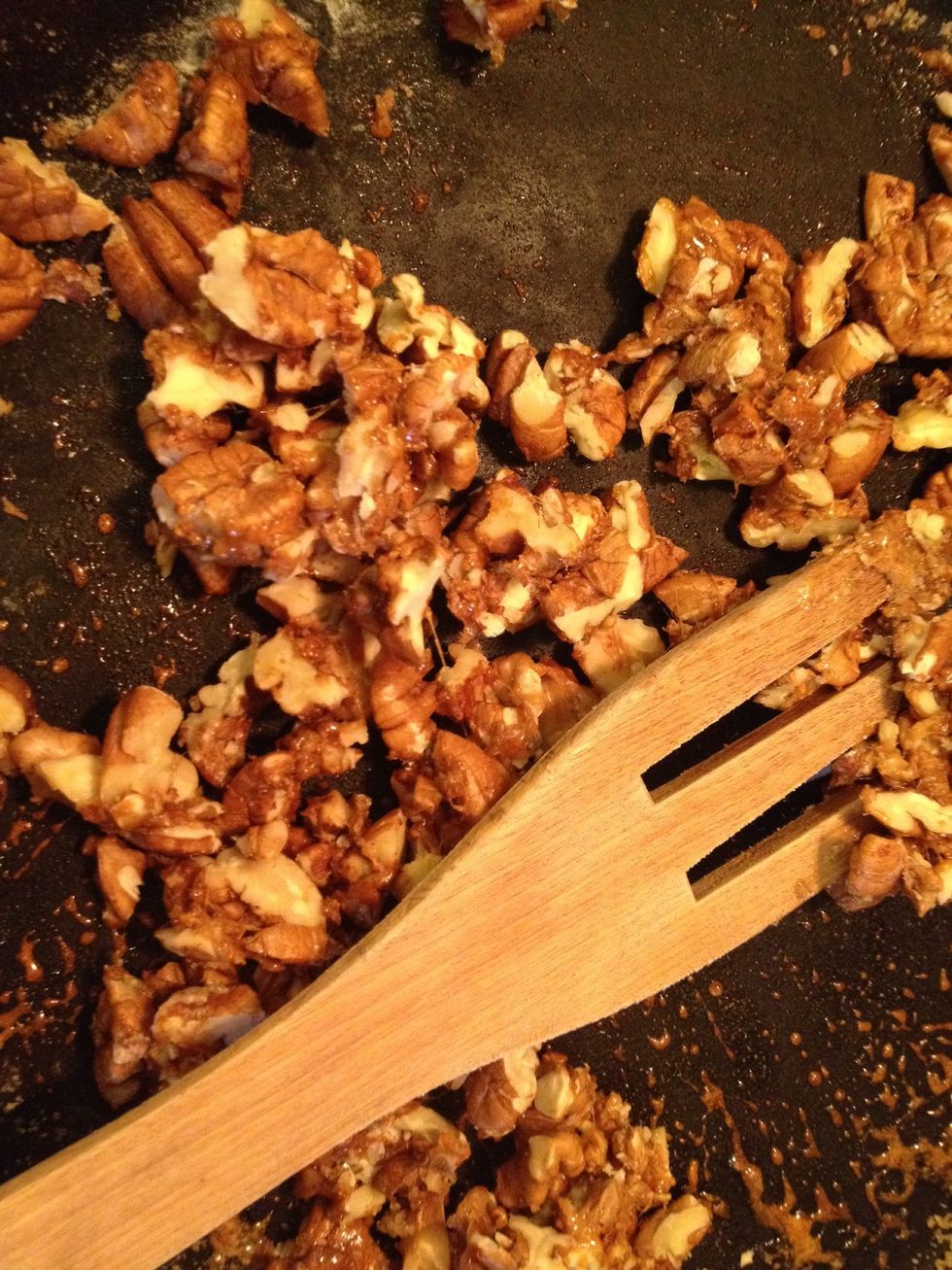 Add the chopped nuts and stir. See to that all nuts are covered.