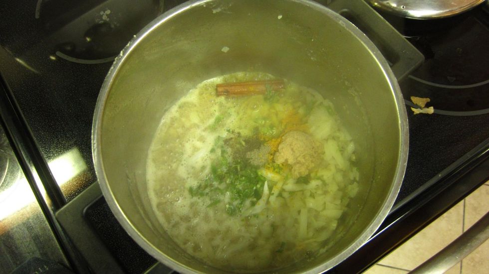 Add the chopped onion, 1 Ceylon Cinnamon stick, 1 tbs. garlic, 1/2 tsp. turmeric, 1/2 tsp black pepper, finely chopped curry leaves and 1 finely chopped green chili and saut\u00e9 for about 3 minutes.