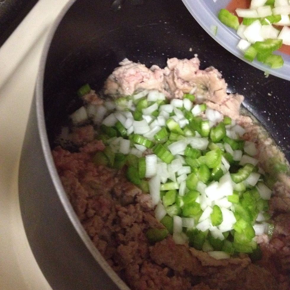 Add the chopped onion and celery while the meat is browning.