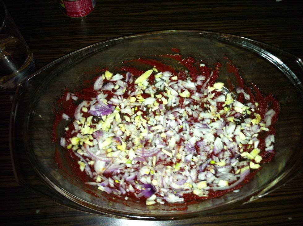 Add the chopped onion and garlic to the bowl.