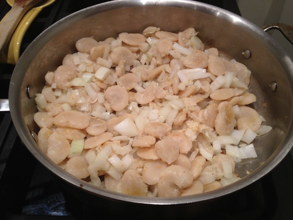Add the chopped onion, garlic, and salt to taste. Stir and cook for a couple minutes.