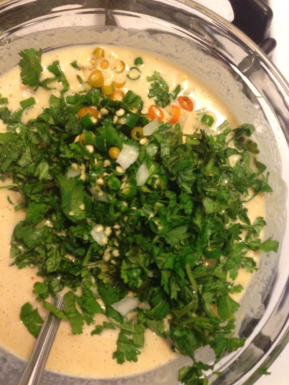 Add the chopped onion, green chillies, cilantro and lemon extract.