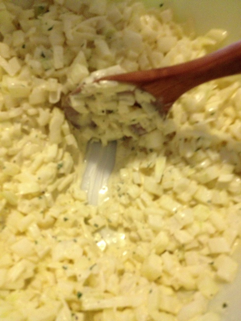 Add the chopped onion. You want there to be just enough vinaigrette to coat the onions and pool in the bottom of the bowl but not when stirring. (See photo) Allow the onions to marinate.