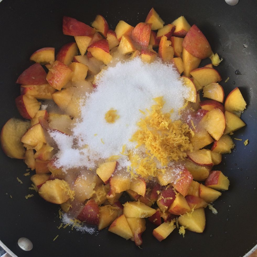 Add the chopped peaches, lemon zest, sugar and water to pan.