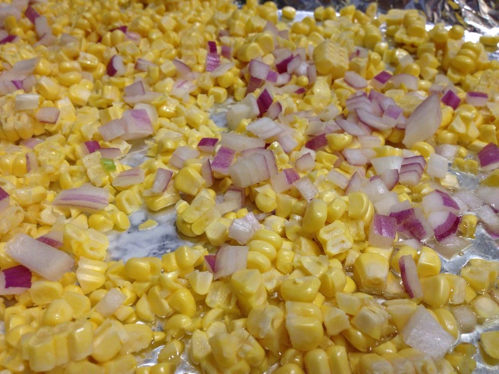 Add the chopped red onions to the corn.