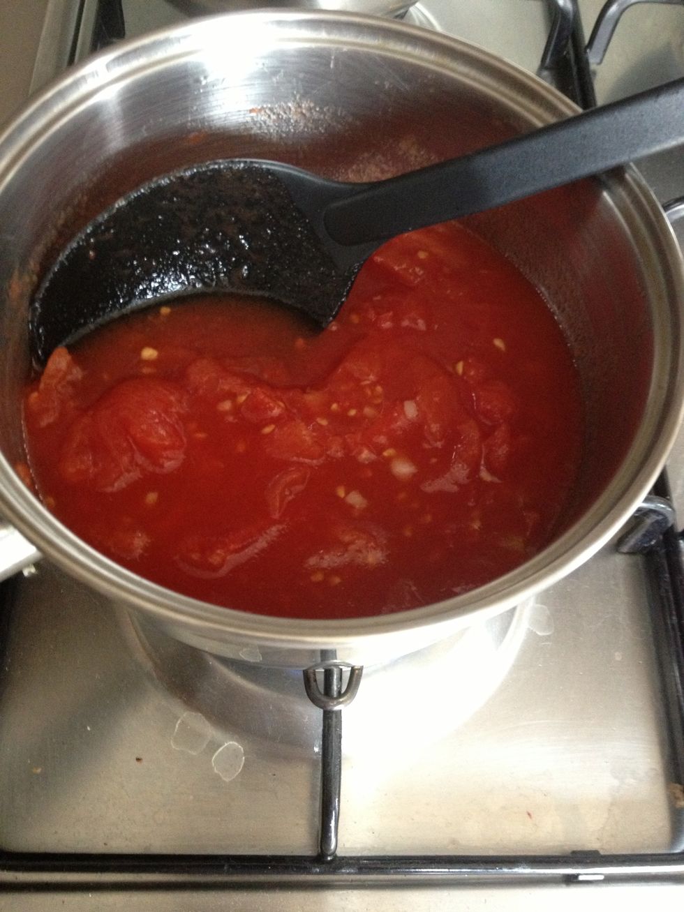 Add the chopped tomatoes and bring to the boil.