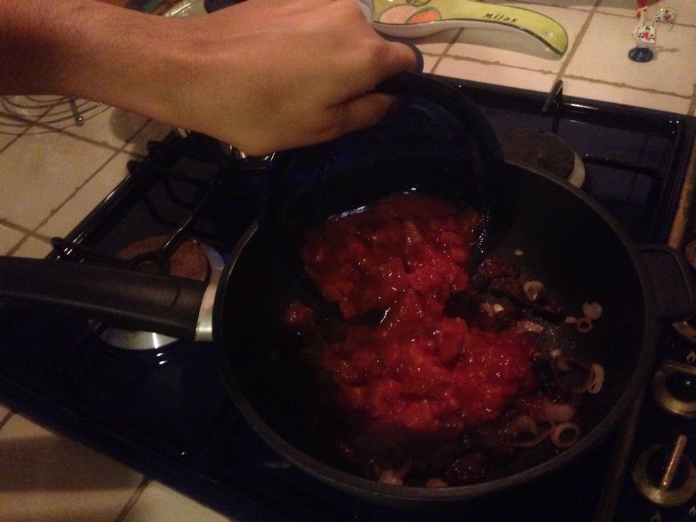 Add the chopped tomatoes, stir and simmer for 15 mins