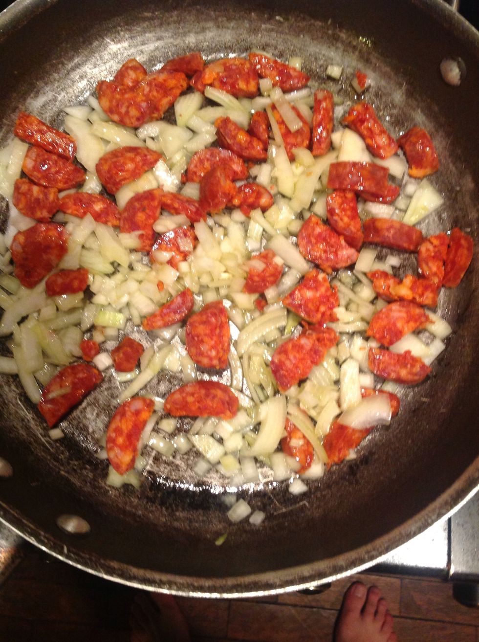 Add the chorizo and onion to the pan. Fry for 10 mins