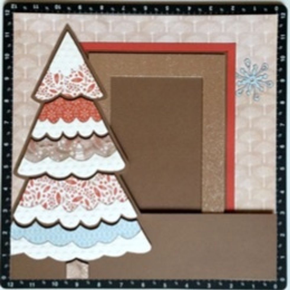 Add the Christmas Tree layer with 3-D Foam Tape, leaving the backing on areas that overlap where they photo will be placed. This will make it easy to slide the picture behind the different layers.