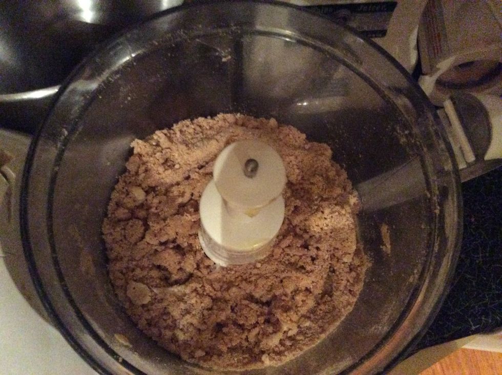 Add the cinnamon, nutmeg, and butter to the crushed biscuits