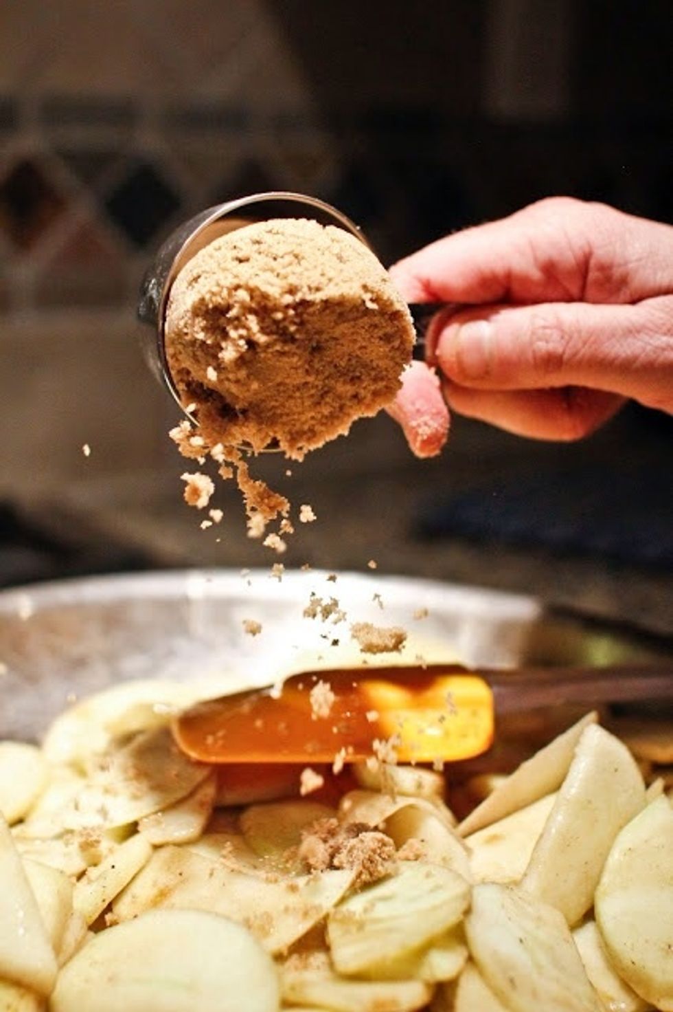 Add the cinnamon, the cardamom, the cloves, and the brown sugar.