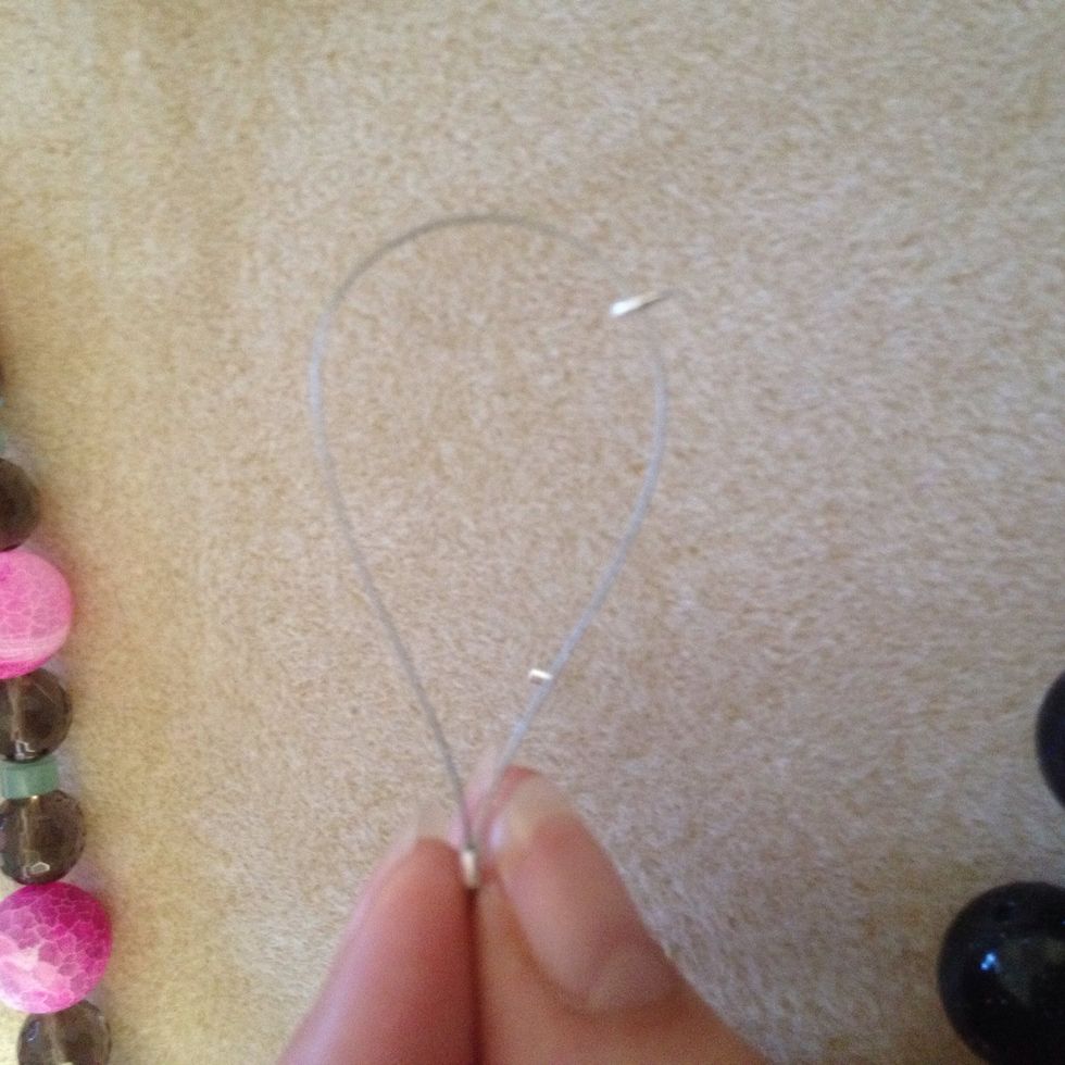Add the circle finding to the end off the wire like this and then loop the end into the same clasp finding like so