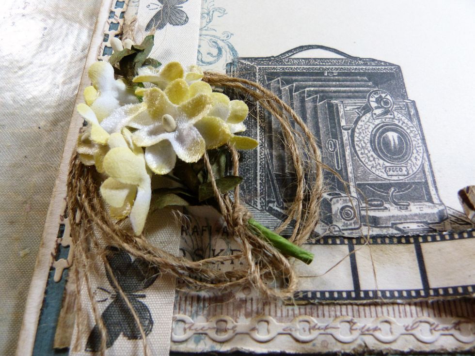 Add the circles string from flower add on and a bunch yellow flowers from the main kit to the bottom left hand corner.