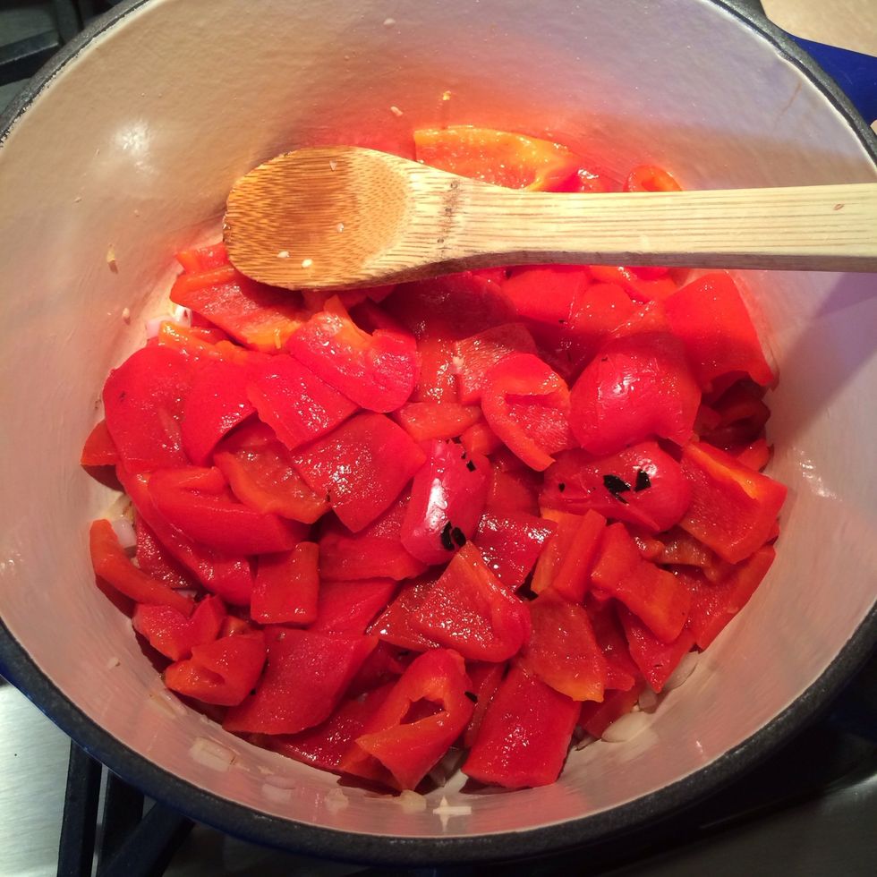 Add the cleaned and cut fire roasted peppers to the stock pot.