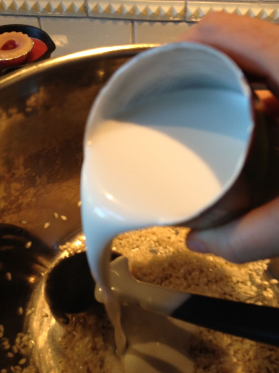 Add the coconut milk and bring the mixture to a gentle boil  while stirring.  Continue to stir until the liquid is almost but not completely absorbed.