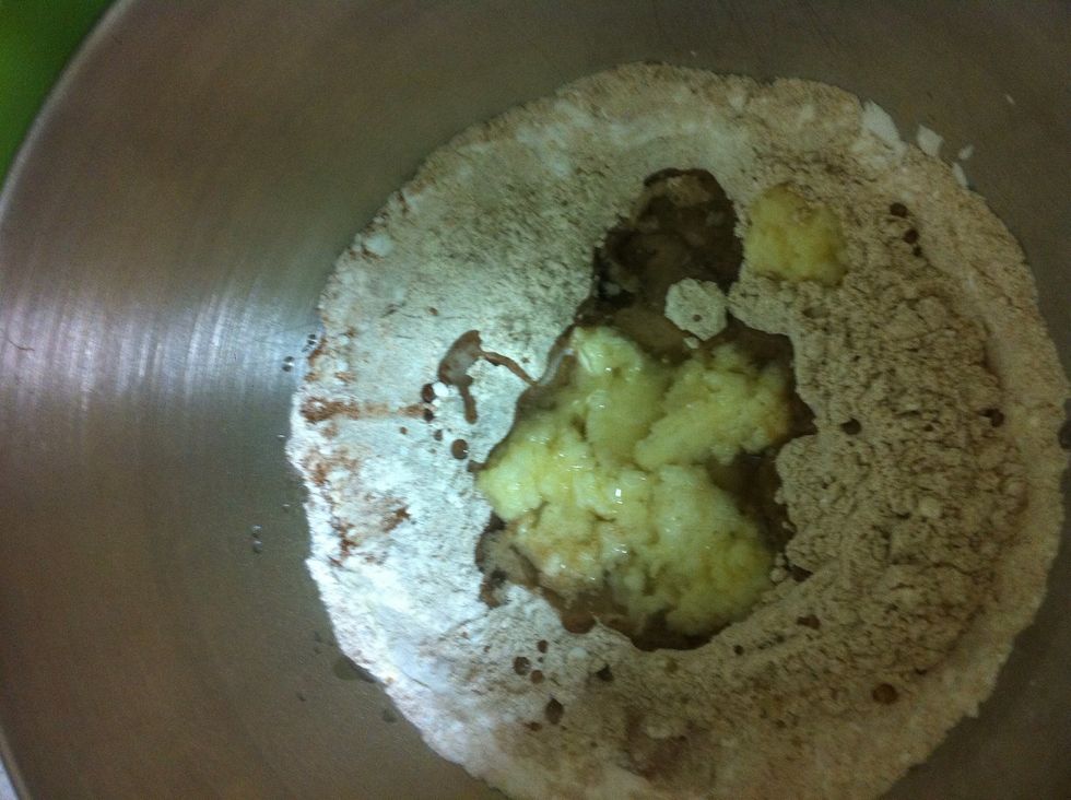 Add the coconut oil, water, applesauce mix into the flour
