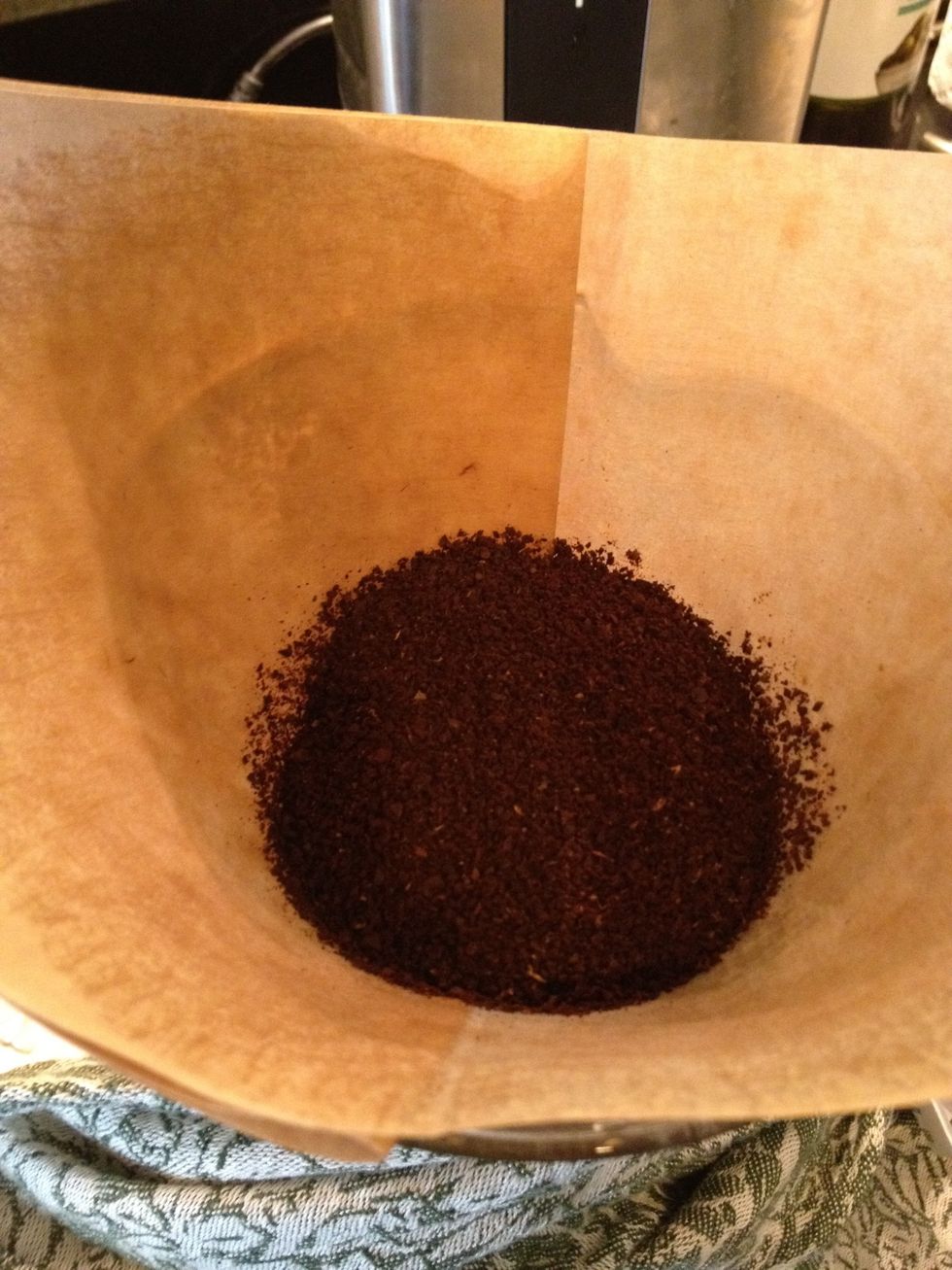 Add the coffee. The ratio is 7.2g of ground coffee to 4oz of water. remove the filter and dump the warming water.