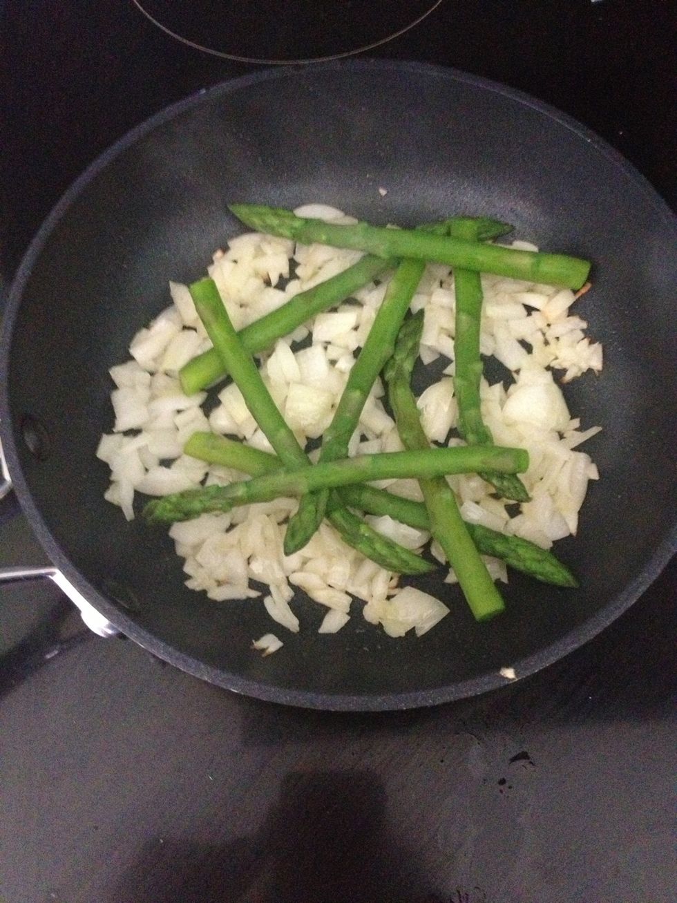 Add the cooked asparagus to the pan. You want it to look like this, with the the asparagus spears crossing over one another.