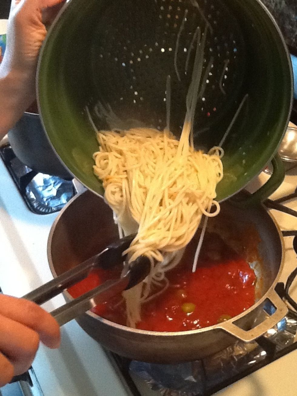 Add the cooked spaghetti to the sauce