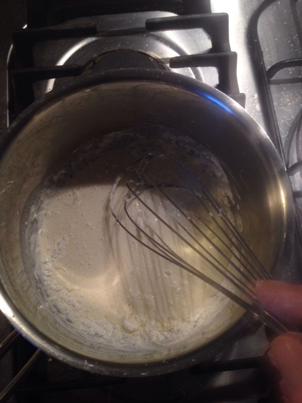 Add the corn flour to your pot and add a bit of the cream. Whisk until all lumps are gone, then add the rest of the ingredients. Turn the heat on.