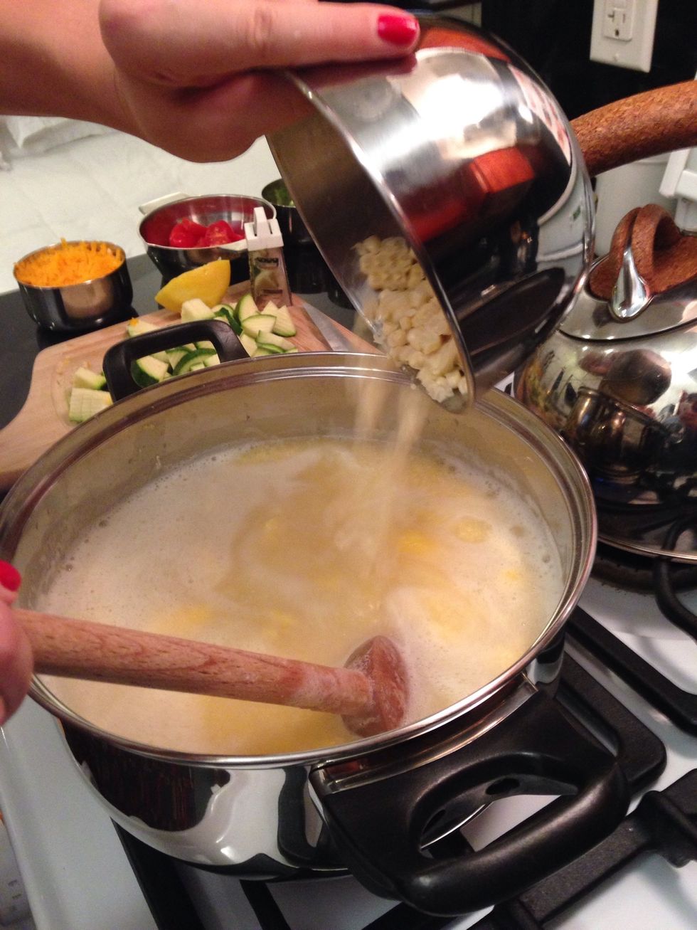 Add the corn to the boiling grits