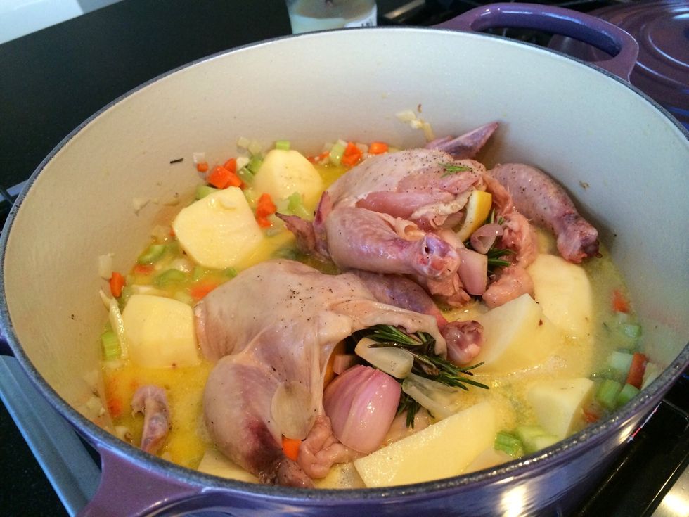 Add the cornish hens back to the cocotte. Cover and place in pre-heated oven for 2 hours. Make sure to check your meat temperature while basting the chickens once or twice to keep it moist.