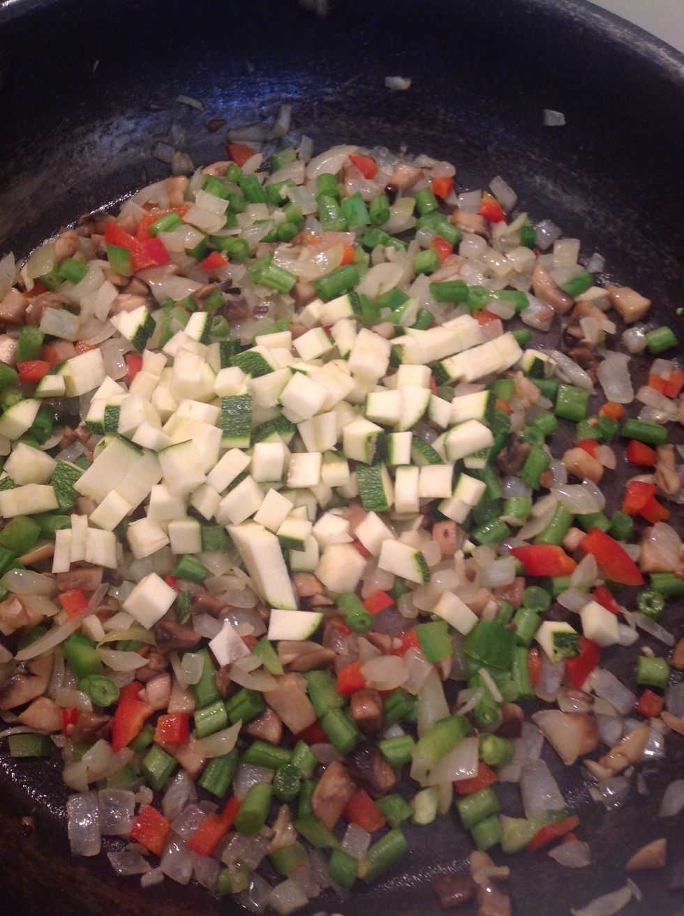 Add the courgettes (zucchini).