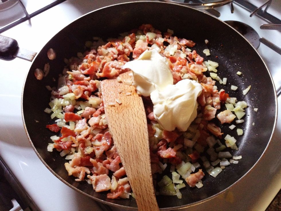 Add the cr\u00e8me fra\u00eeche to the pan. Stir thoroughly with the rest of the ingredients. Turn off the heat about after 30 seconds.