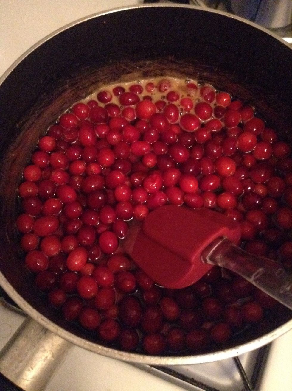 Add the cranberries to the boiling mixture