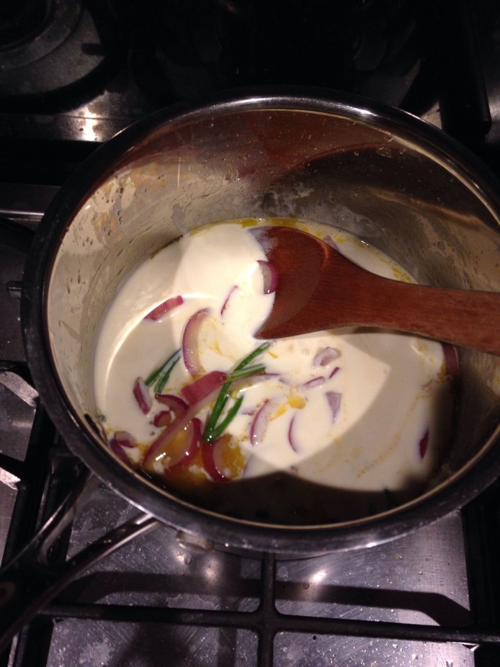 Add the cream and simmer until reduced