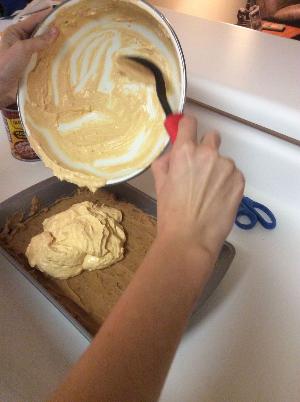 Add the cream cheese and sour cream mixture on top of the refried beans