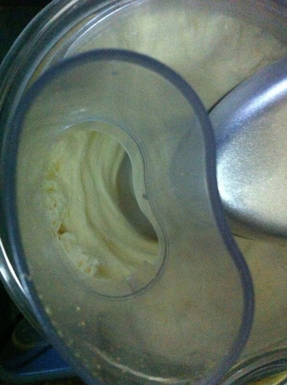 Add the cream cheese in your food processor and turn it on.