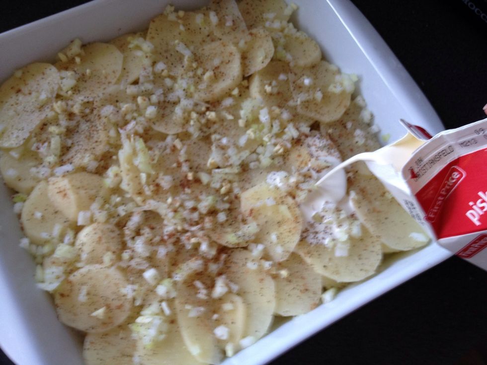 Add the cream slowly, so it don't ruin the layers of potatoes.