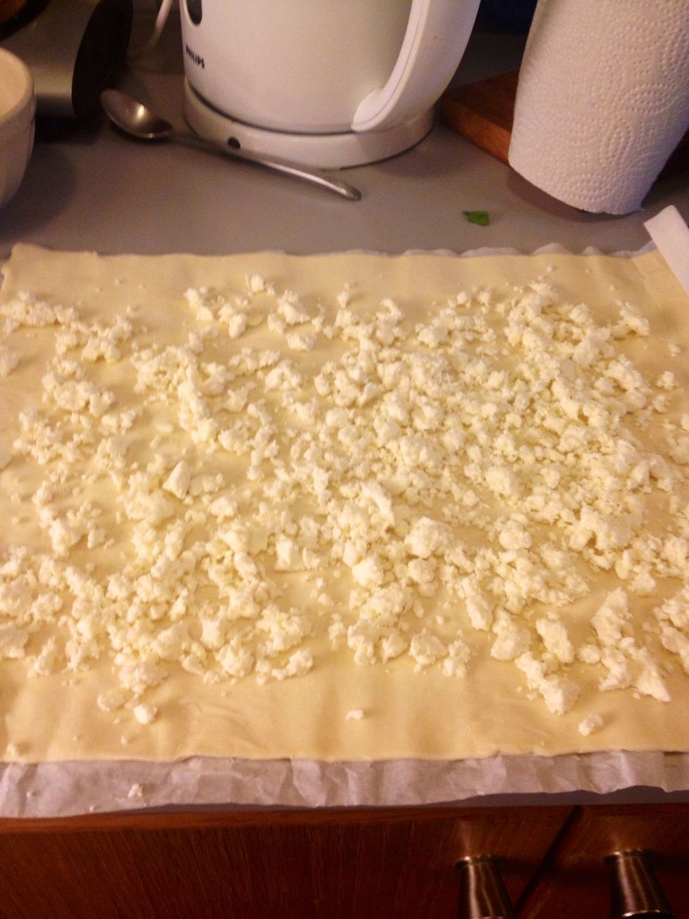 Add the crumbled feta cheese. Try to spread it out evenly.