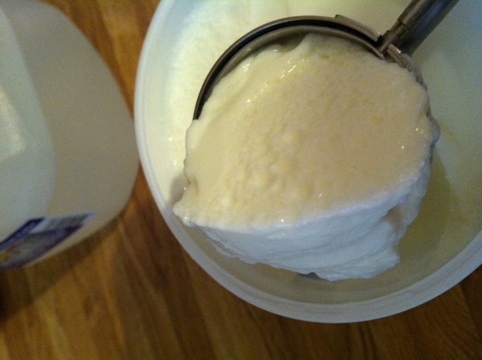 Add the cup of yogurt, if you are using the ice cream scoop it's four of them, otherwise use a cup of plain yogurt