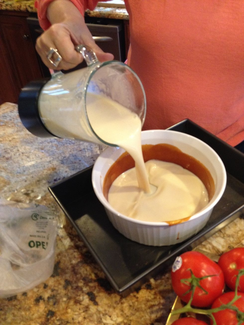Add the custard mixture to the bowl over the sugar