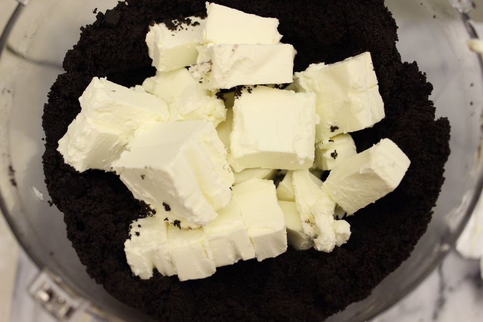 Add the cut up cream cheese to the food processor.