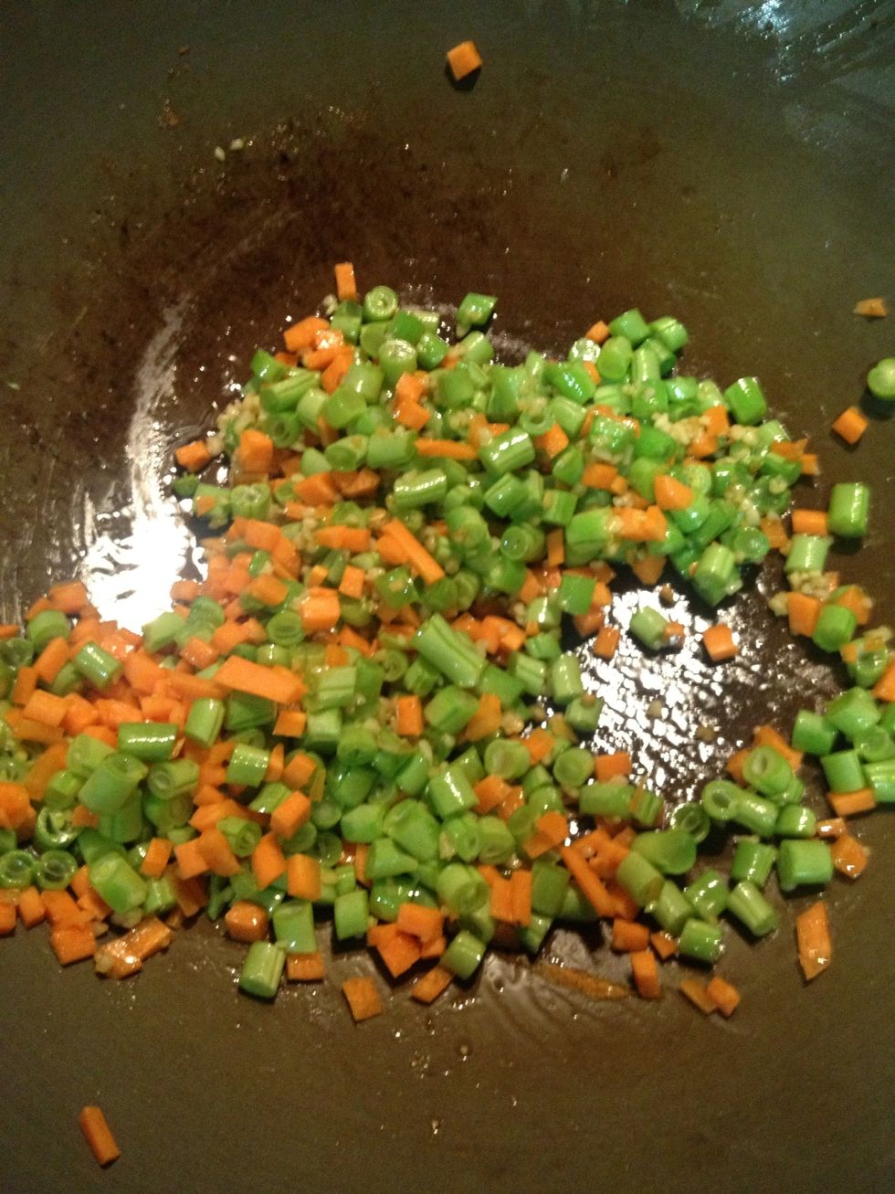 Add the diced French beans and carrots and stir fried for about 3 minutes or until the French bean is cooked. Add some salt here.