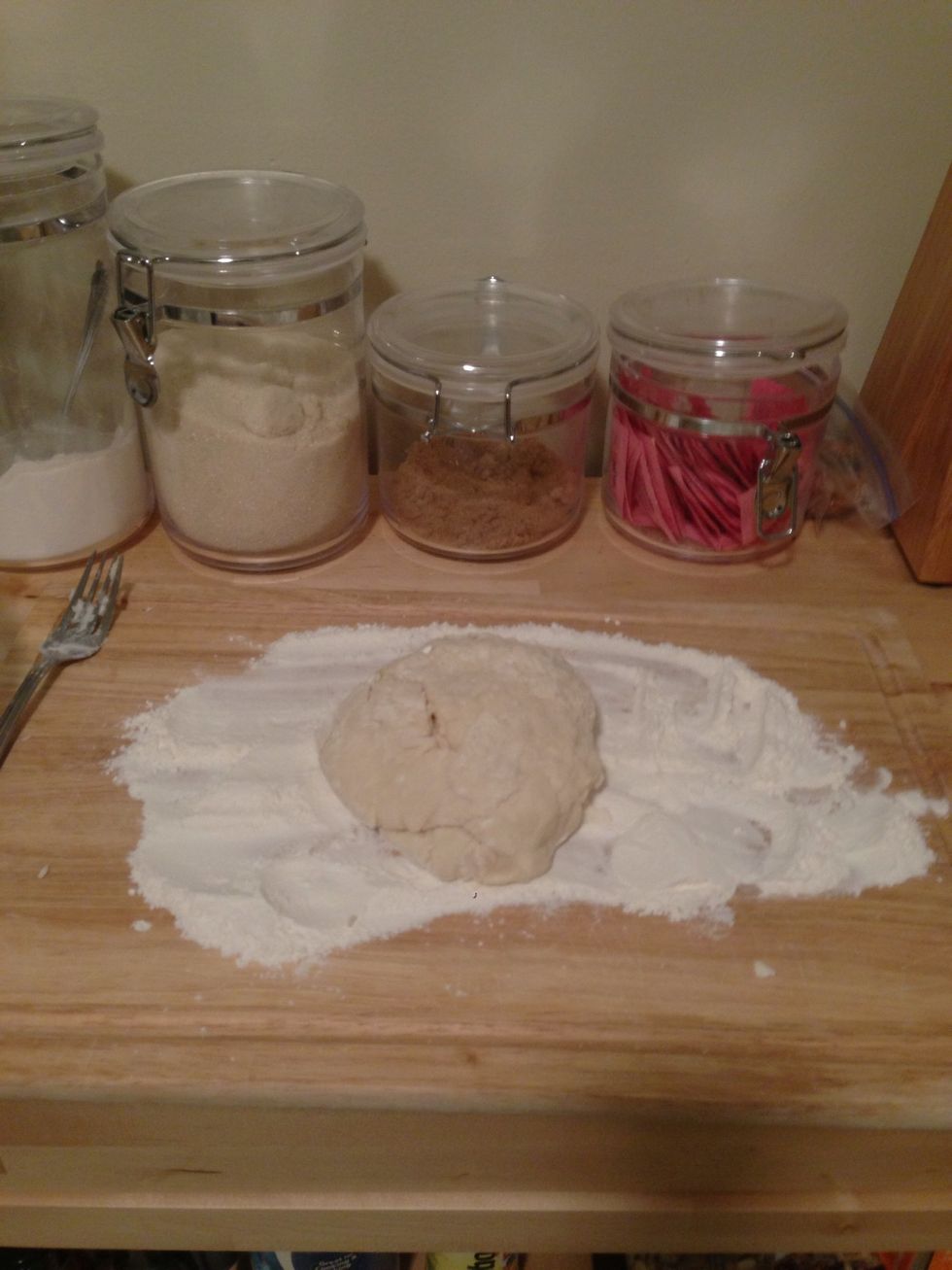 Add the dough to the floured board.