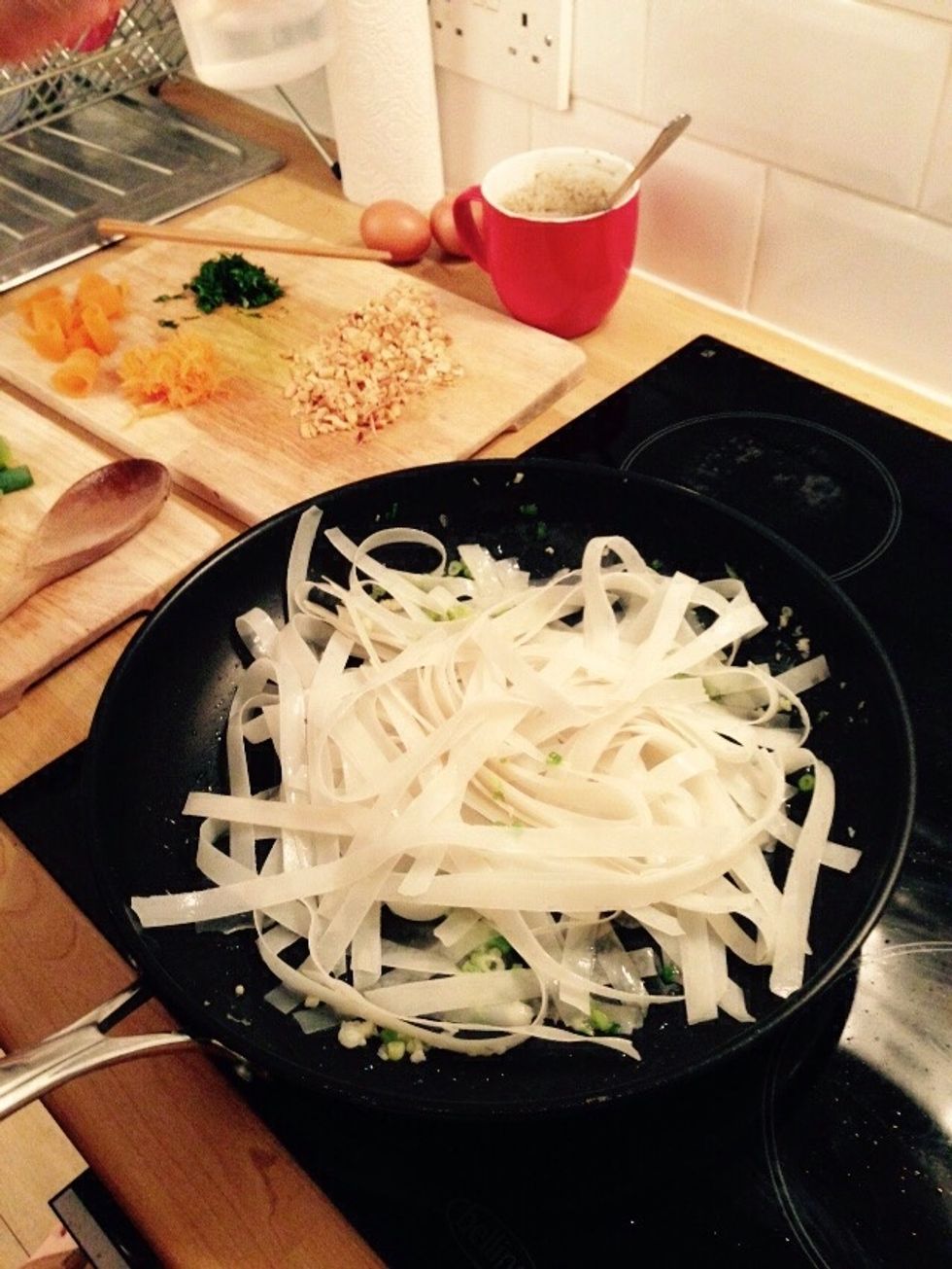 Add the drained noodles.
