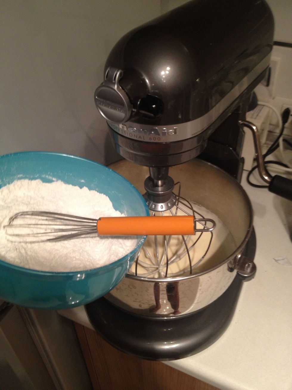 Add the dry in half at a time on low speed. Now go preheat your oven to 200c or 400f