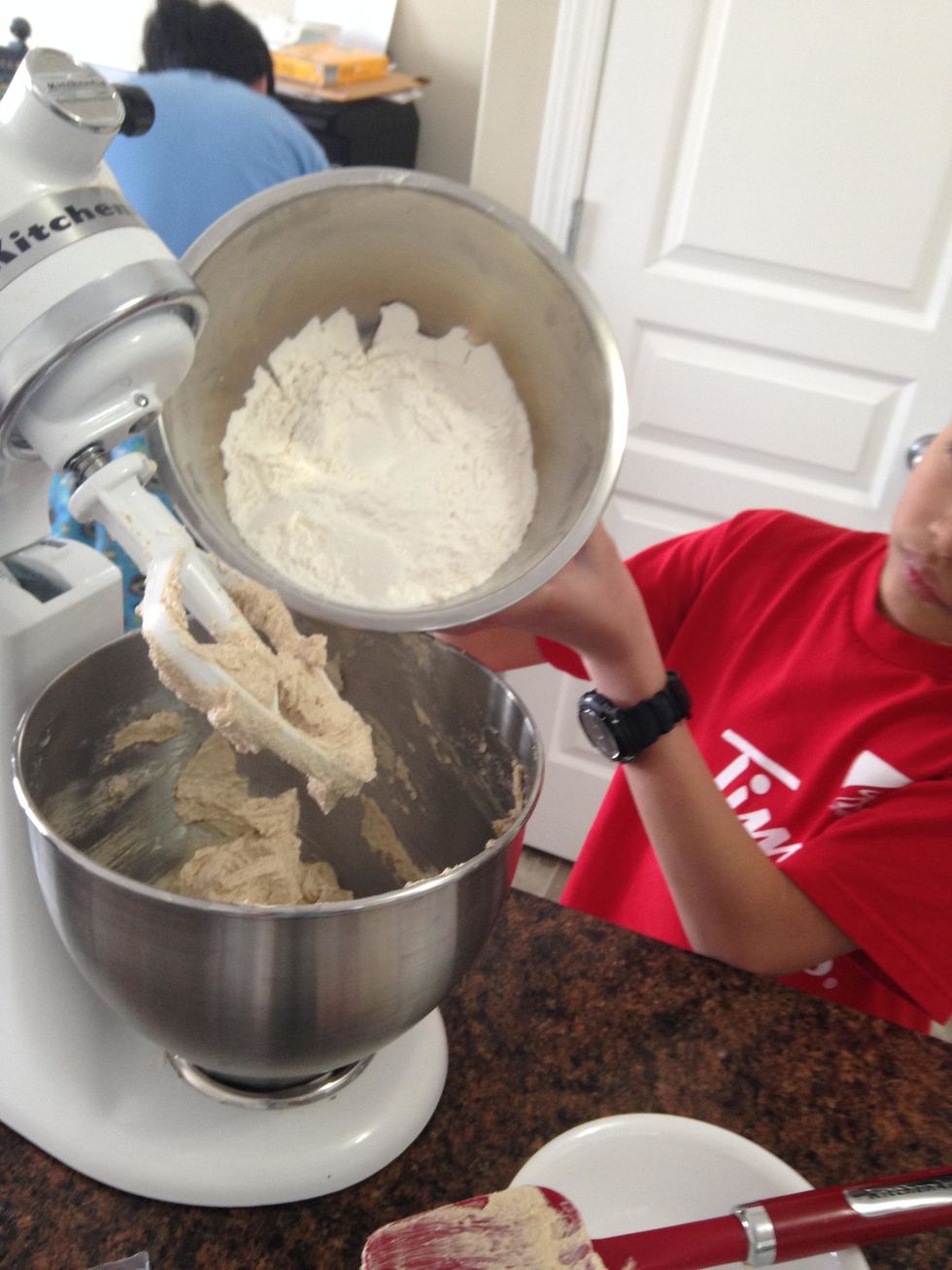 Add the dry ingredients (flour, baking powder, baking soda and salt) at a low speed
