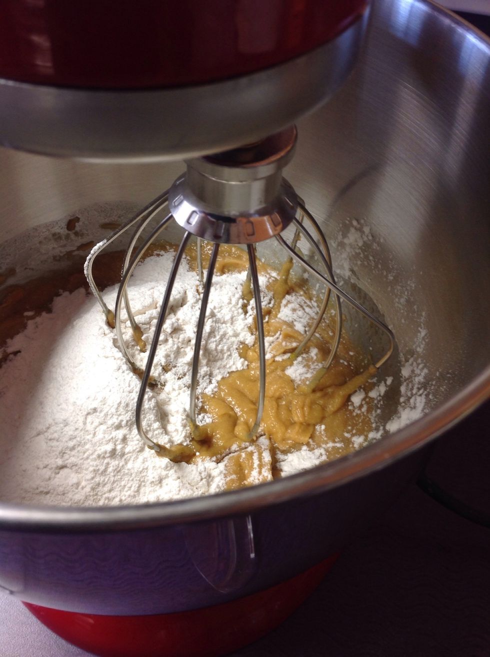 Add the dry ingredients slowly into the mixture