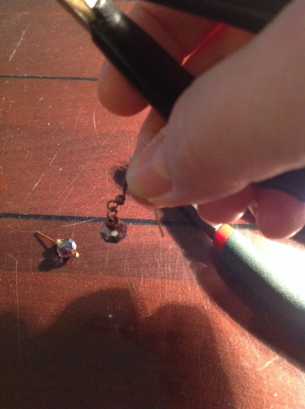 Add the ear wire inside the opening of the loop