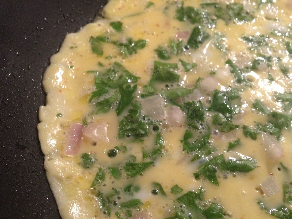 Add the egg mix in a thin layer. When the edges look as above. Flip!! :)