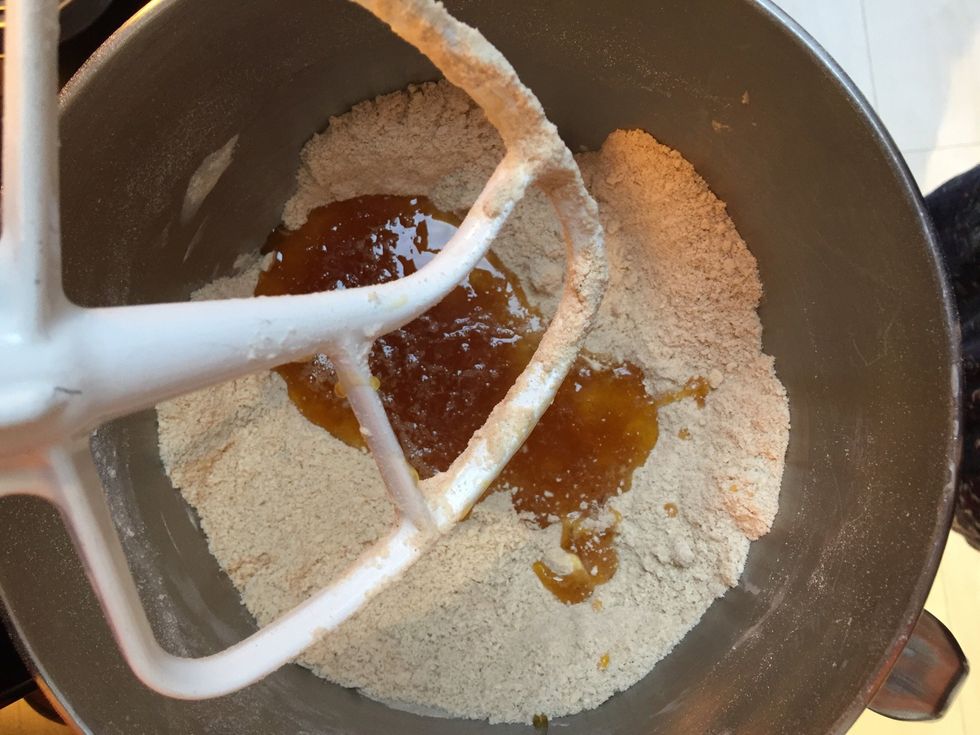 Add the egg-syrup mixture to the flour mixture and beat together.