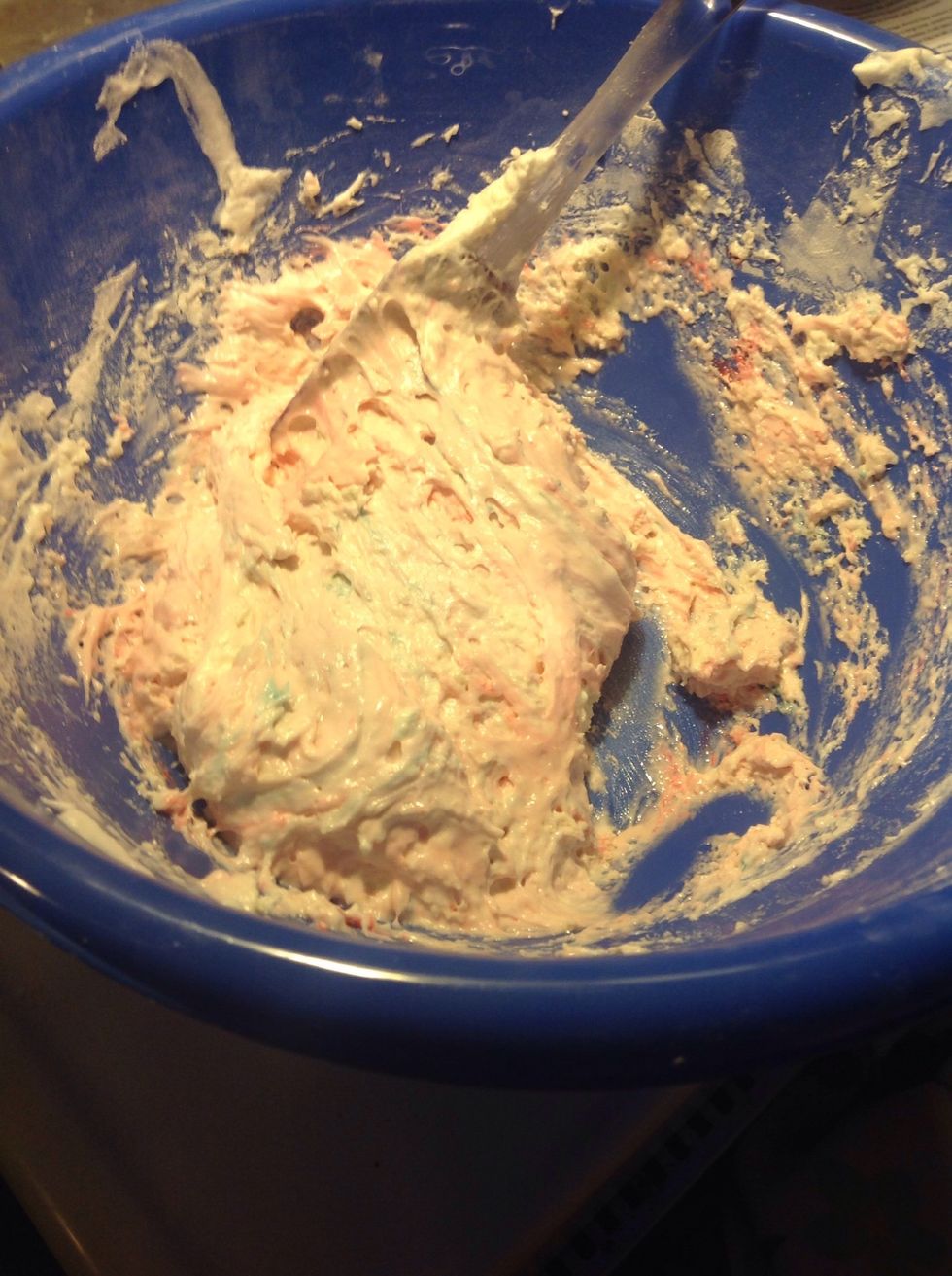 Add the egg white mixture to the batter then draw a line trough the middle, fold and turn the bowl with each fold. Add your food coloring and extract to the batter