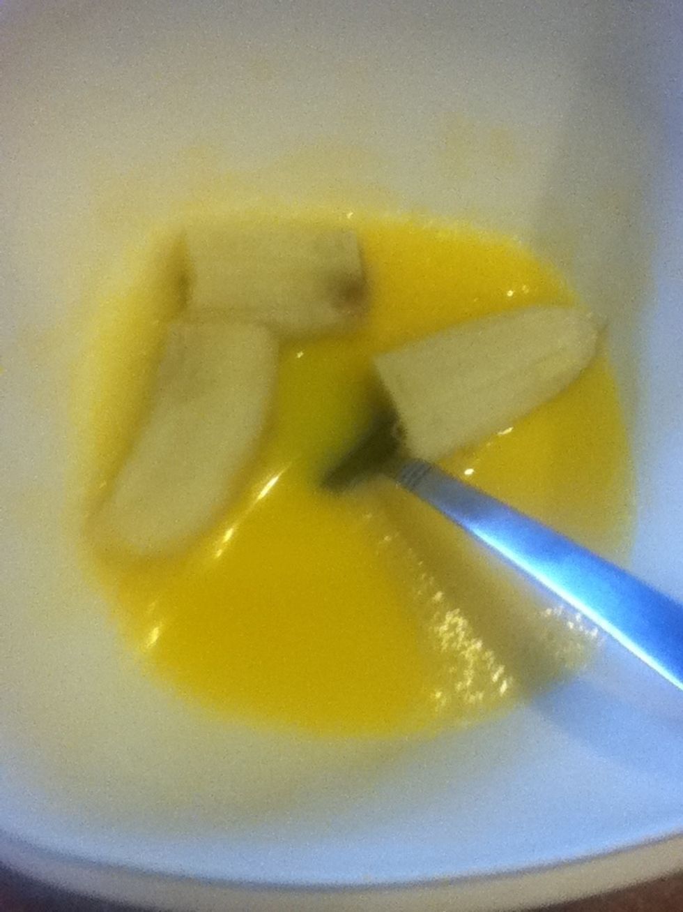 add the egg with very little water and beat together with a fork after beaten add cut bananas